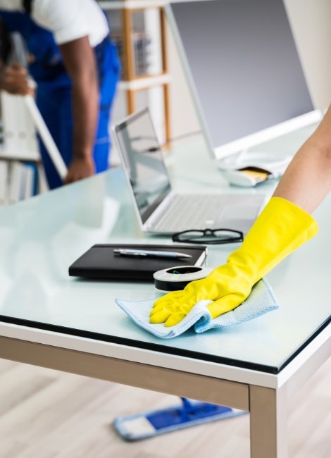 WHY US OFFICE CLEANING COMMERCIAL CLEANING clean, modern table being cleaned for commercial cleaning